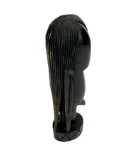 Lade das Bild in den Galerie-Viewer, Black sculpture of a figure with long hair on a white background