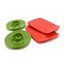 Load image into Gallery viewer, Two green egg cups and two red square plates on a white background