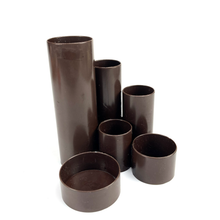 Lade das Bild in den Galerie-Viewer, Set of brown cylindrical plastic pipes on a white background
