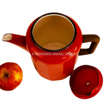Load image into Gallery viewer, Red teapot with a lid and an apple on a white background, featuring Bendixen Mikael Decor branding.
