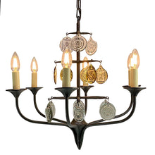 Load image into Gallery viewer, Svend Aage Holm Sørensen Viking 6-Arm Cast Iron Chandelier, Amber Glass, 1960s. Decorative chandelier with candle-style lights and hanging coins on a white background