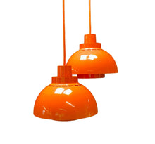 Load image into Gallery viewer, Two orange pendant lights on a white background