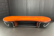 Load image into Gallery viewer, Wooden wall table with metal shelves against a gray wall.