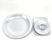 Load image into Gallery viewer, Round white melamine egg cup, buttering board, and a plate with a central indentation on a white background
