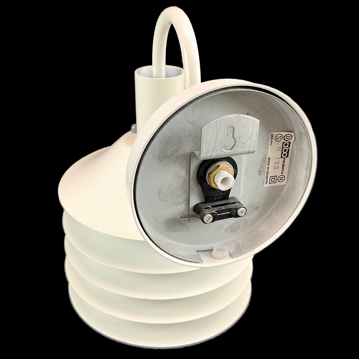 White light bulb socket on a black background. This rare vintage Danish lamp is a statement piece for collectors and interior enthusiasts, blending minimalist aesthetics with functional elegance.