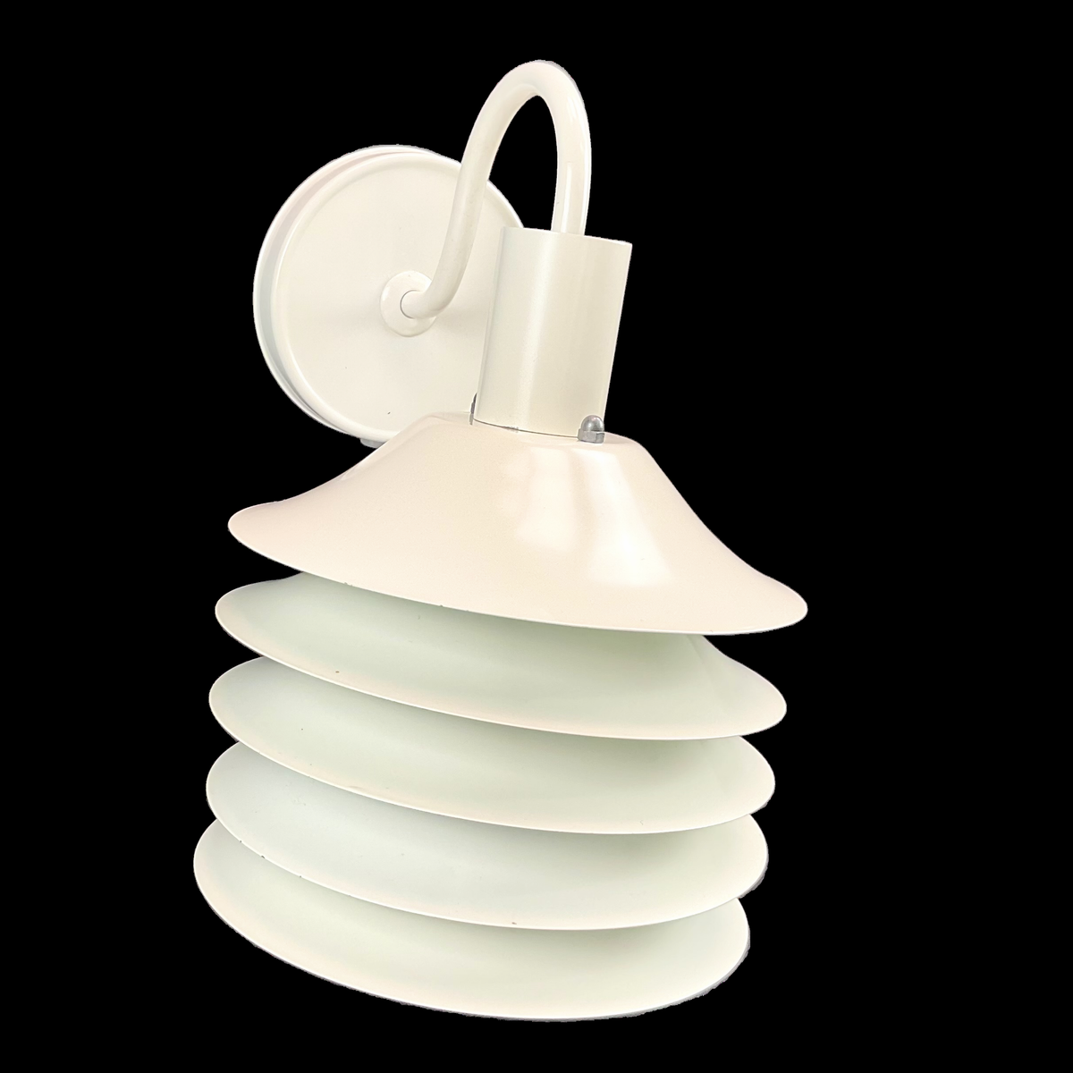 White wall-mounted lamp with layered design on a black background. This rare vintage Danish lamp is a statement piece for collectors and interior enthusiasts, blending minimalist aesthetics with functional elegance.