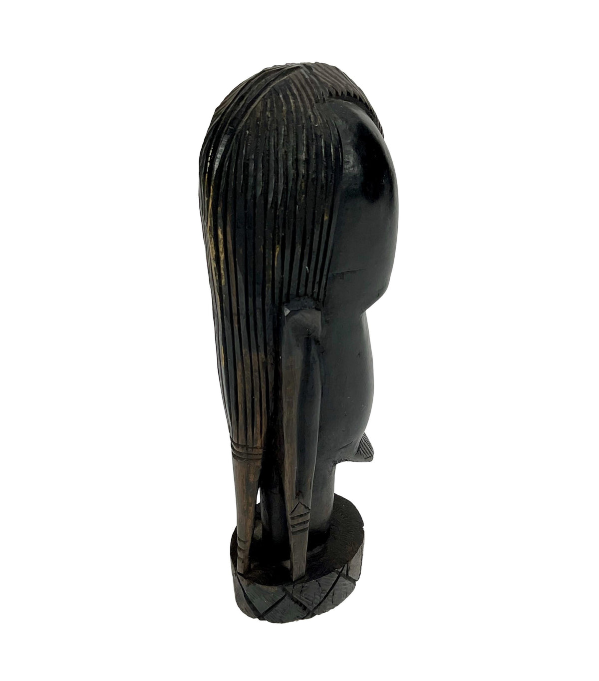 Black sculpture of a figure with long hair on a white background