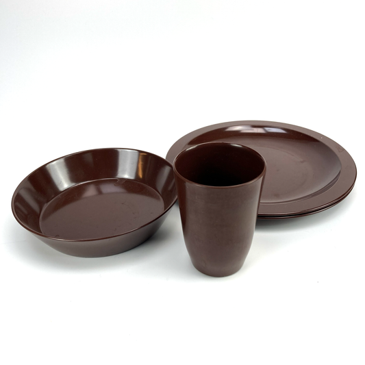 Set of brown melamine plates and a cup on a white background