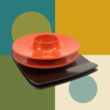 Load image into Gallery viewer, Egg cup and sandwich board are placed on 60's colour block art.
