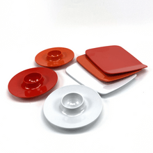 Load image into Gallery viewer, Set of red and white melamine plates on a white background
