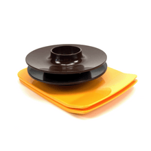 Load image into Gallery viewer, Black and orange melamine components on a white background
