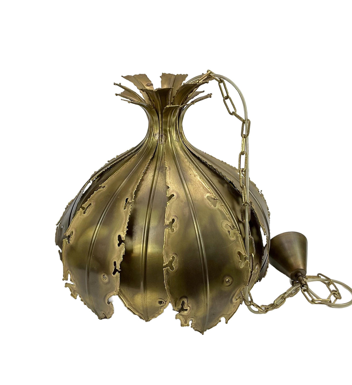 Decorative brass pendant light on a white background