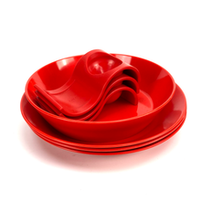 Lade das Bild in den Galerie-Viewer, Stack of red melamine plates on a white background

