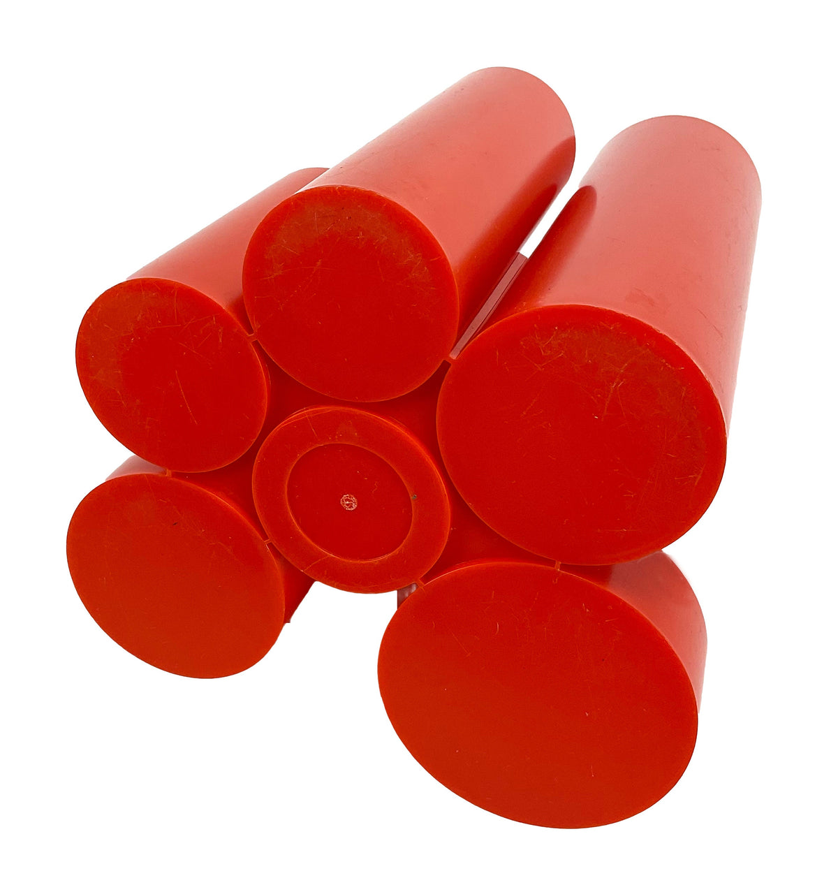 Red cylindrical objects stacked on a white background