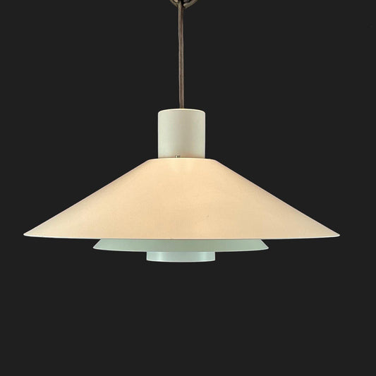 Pendant light with beige shade on a black background