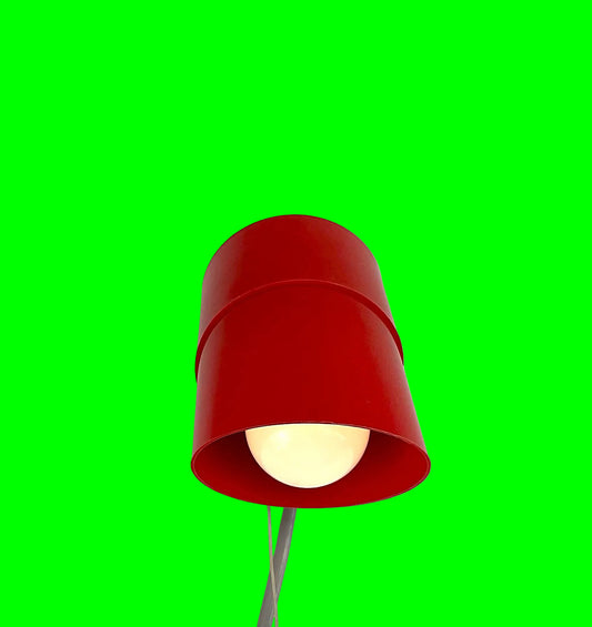 Red lampshade on a green background
