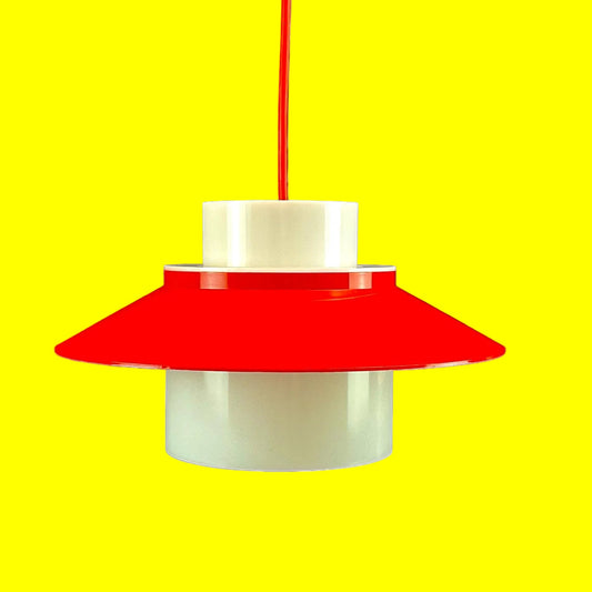 Red pendant lamp with a white base on a white background