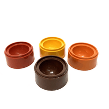 Load image into Gallery viewer, Four small round containers in different colors on a white background
