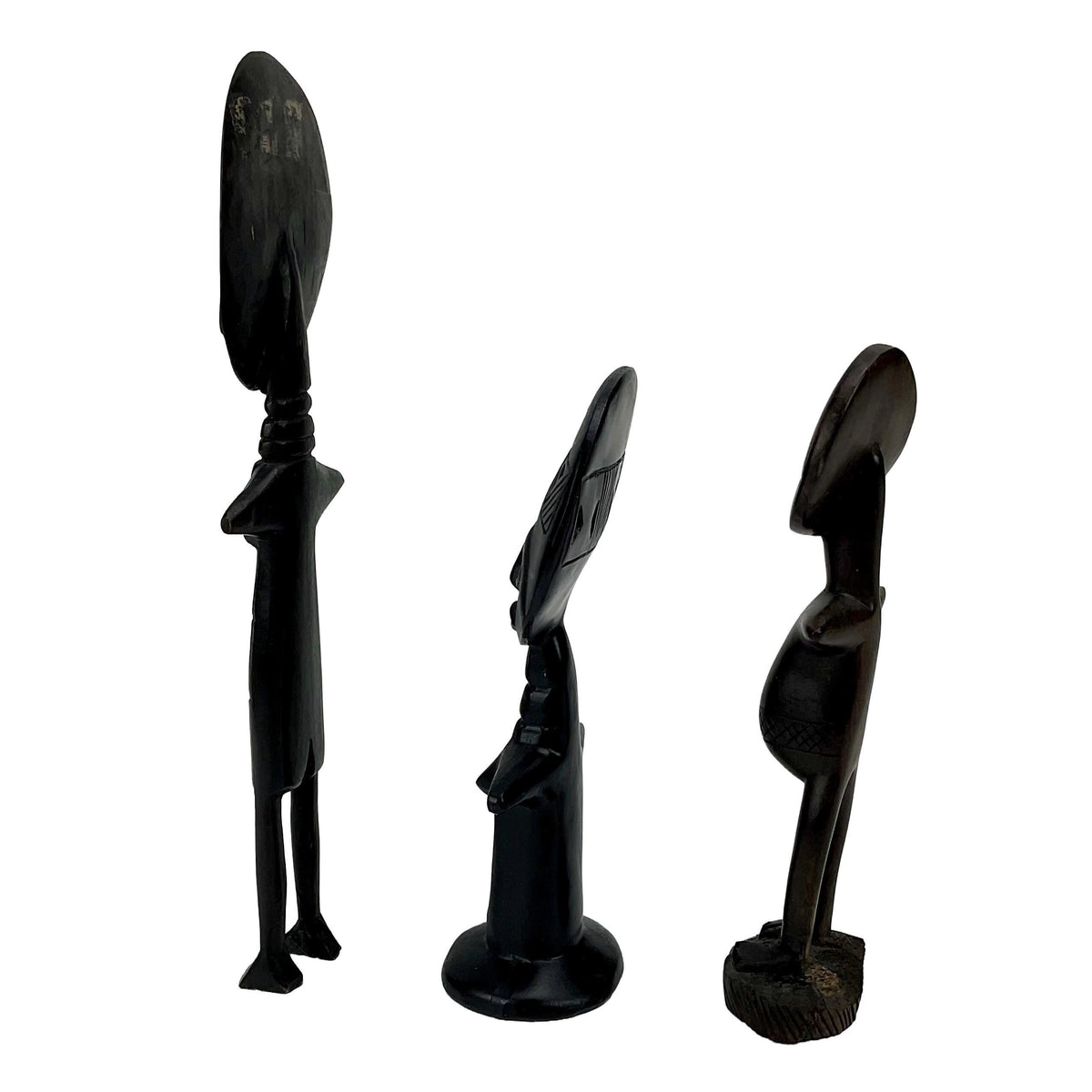 Three black abstract sculptures on a white background