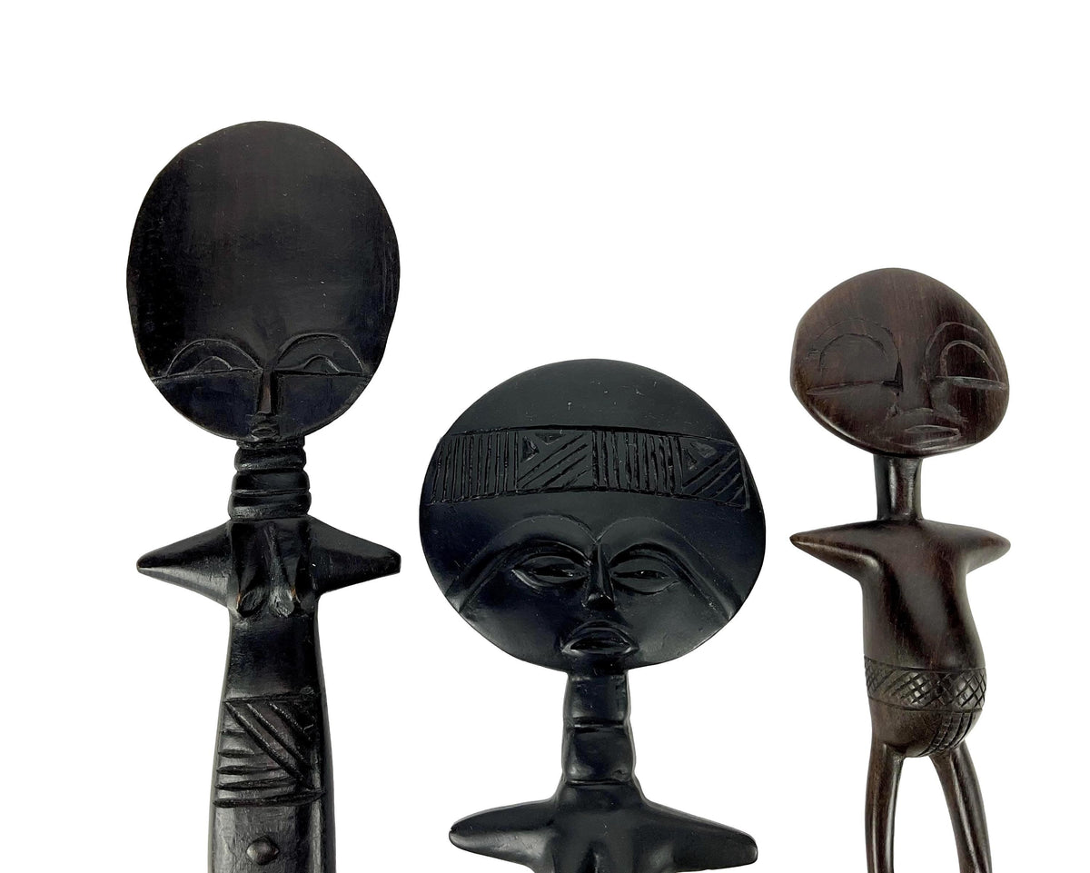 Black decorative curtain tiebacks with intricate designs on a white background