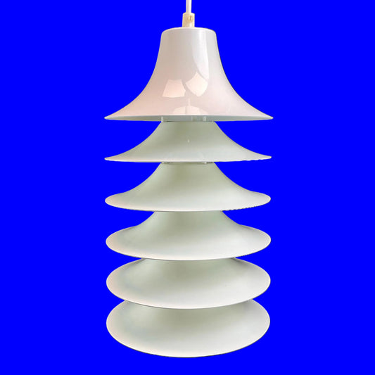 Stacked glass pendant lamp on a royal blue background
