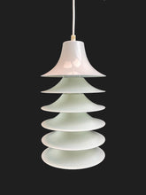 Load image into Gallery viewer, Pendant light with layered glass design on a black background
