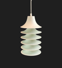 Load image into Gallery viewer, Pendant light with stacked circular design on a black background

