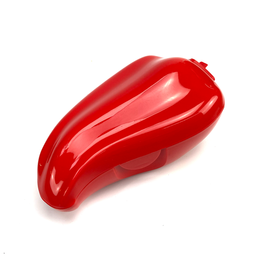 Red pepper-shaped object on a white background