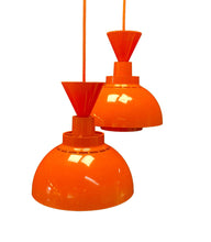 Load image into Gallery viewer, Two orange pendant lights on a white background
