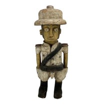 Lade das Bild in den Galerie-Viewer, Wooden figurine of a person wearing a hat and carrying a bag on a white background
