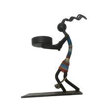 Load image into Gallery viewer, Metallic sculpture of a figure with a colorful scarf and candle holder on a white background

