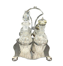 Load image into Gallery viewer, Decorative cruet set with glass bottles and silver holder on a white background
